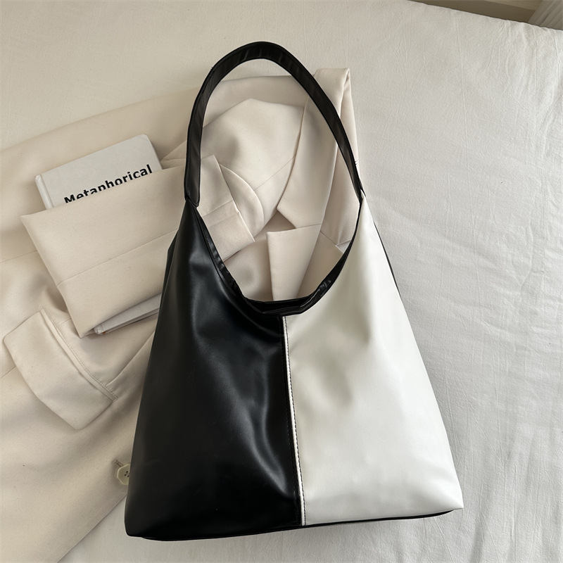 Bolsa de mujer de gran capacidad, textura de 2024, nueva moda simple, bolsa de hombro universal, bolsa de brazo de viaje de color.