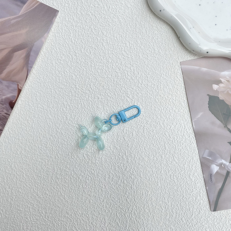 Pequeño Libro Rojo mismo lindo jalea globo láser perro llavero colgante colorido cachorro de dibujos animados teléfono llavero