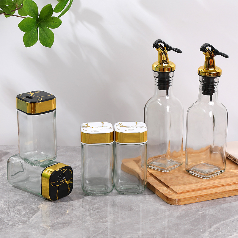 Olla de aceite de cocina juego de cuatro piezas para el hogar combinación de tanque de condimento de lujo ligero sellado a prueba de humedad botella de condimento de vidrio al por mayor