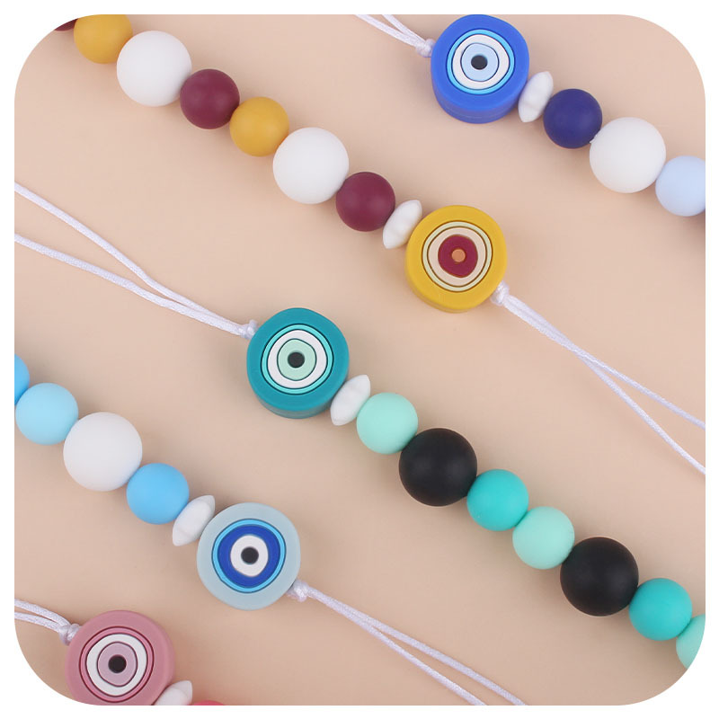 Nueva Cadena de chupete de silicona ojos creativos de dibujos animados juguete de silicona perlas molares Cadena de chupete cadena anti-gota