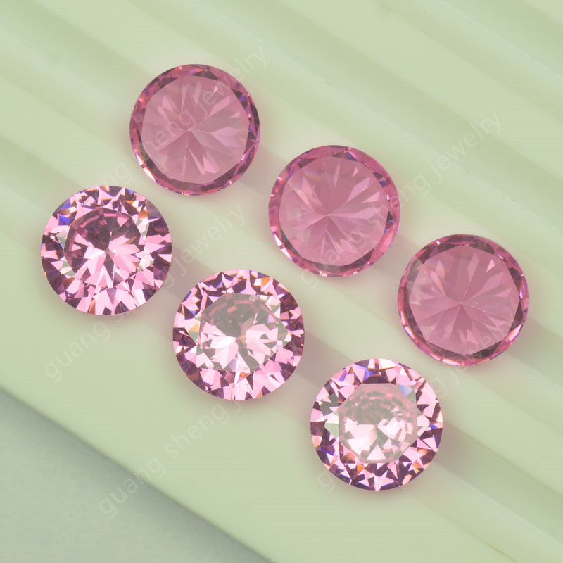 Pink synthesized red gemstone with zircon