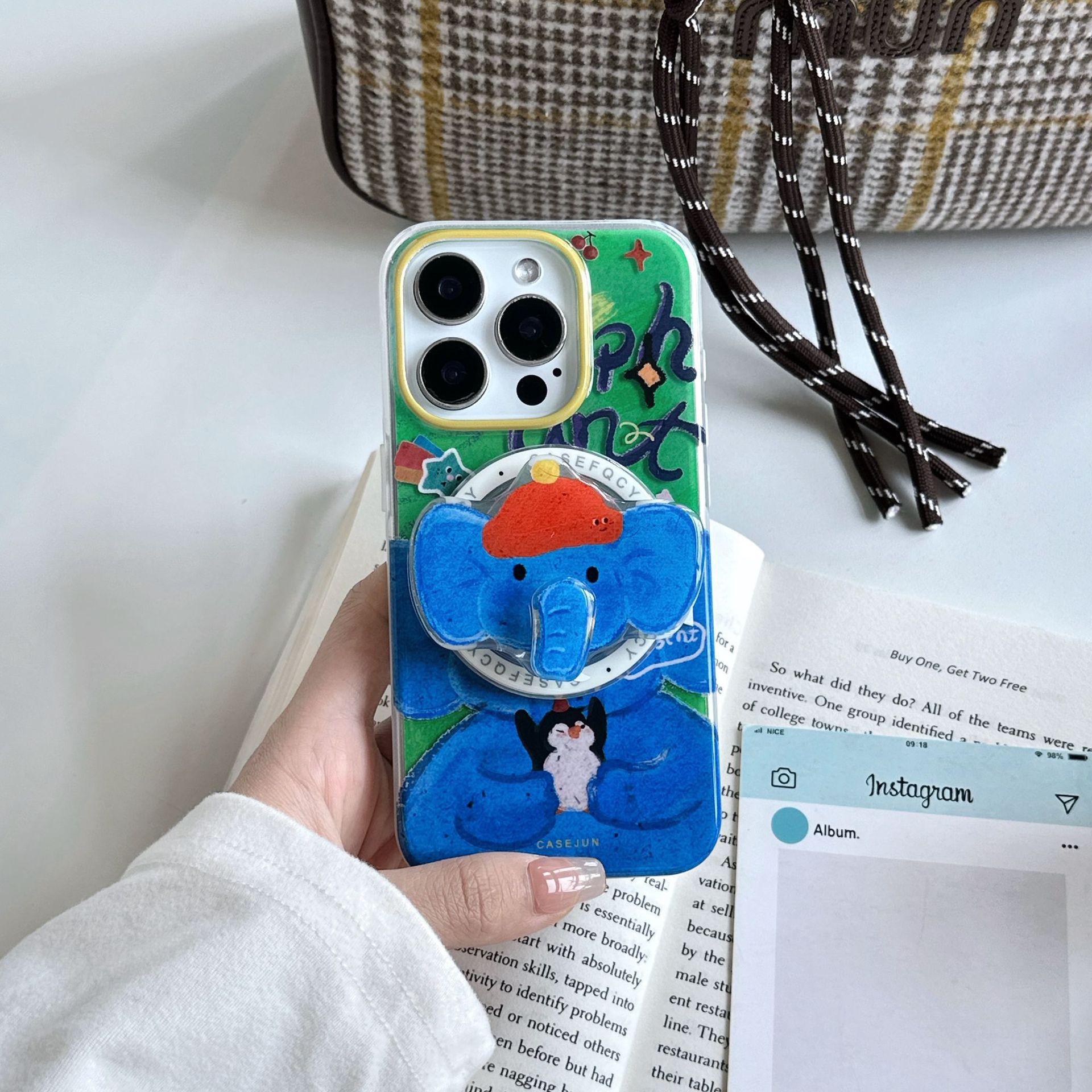 Soporte de nariz de elefante giratorio creativo para Apple 16promax funda para teléfono móvil iPhone15 nuevo 14 atracción magnética