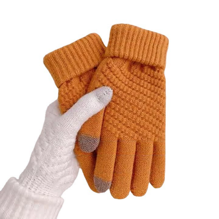 Knitted fashionable warm gloves made of faux fur, trend of season