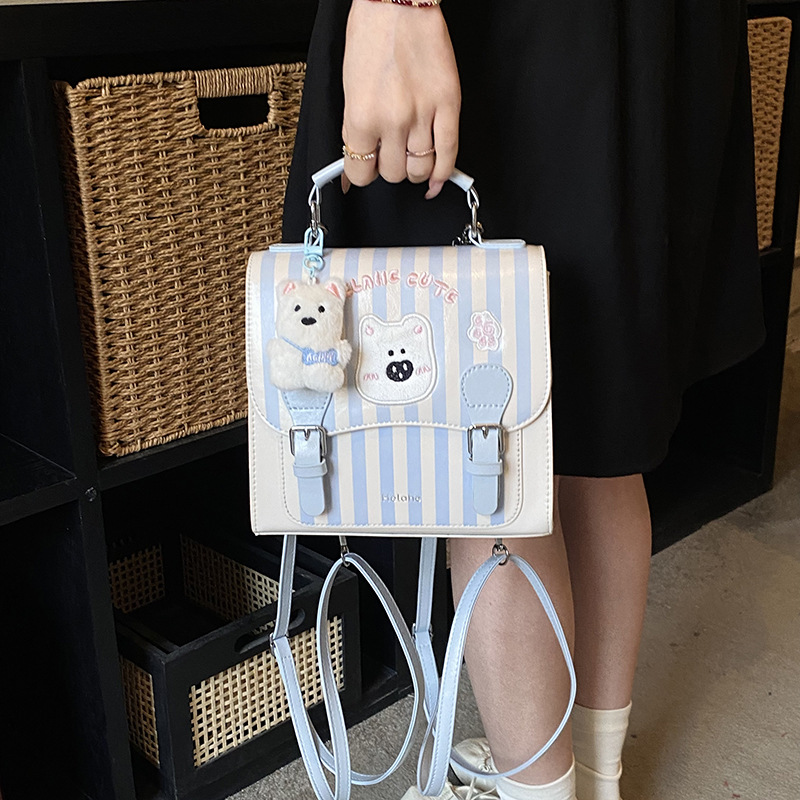 Caricatura encantadora oso, mochila para niños y niñas, mochila para niños a rayas extranjeras, nueva mochila coreana para padres e hijos.