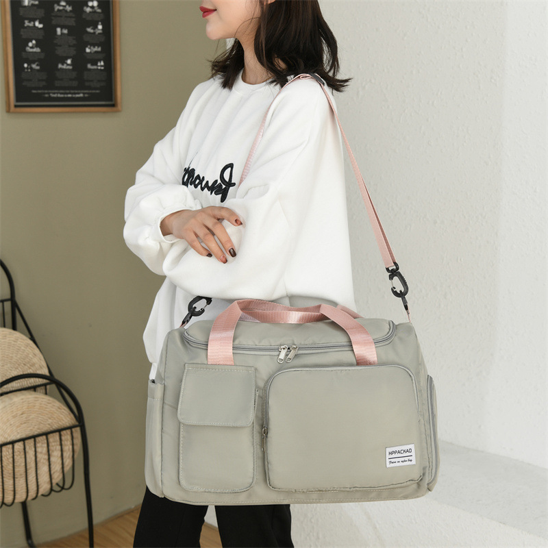 Bolsa de fitness de las mujeres al por mayor nueva gran capacidad crossbody bolsa de deportes de los hombres moda simple impermeable bolsa casual bolsa de viaje