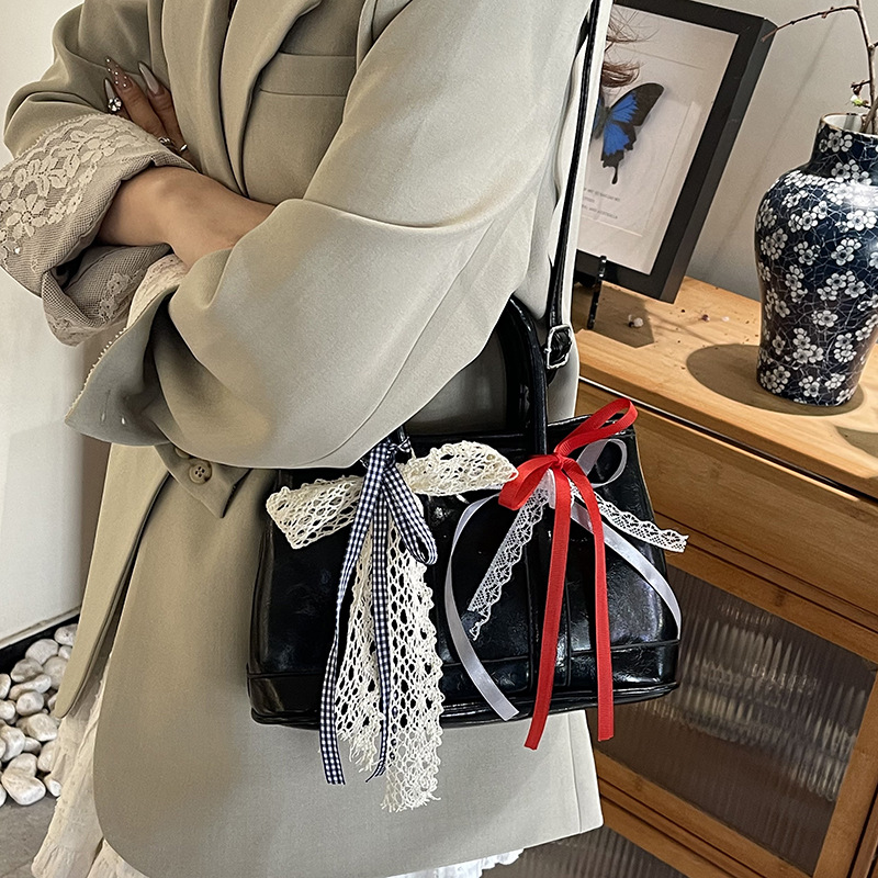 Bolsos de jardín portátiles populares de este año para mujer 2025 nuevos productos bolsos de hombro coreanos de nicho bolsos de cubo de todo fósforo de alta gama