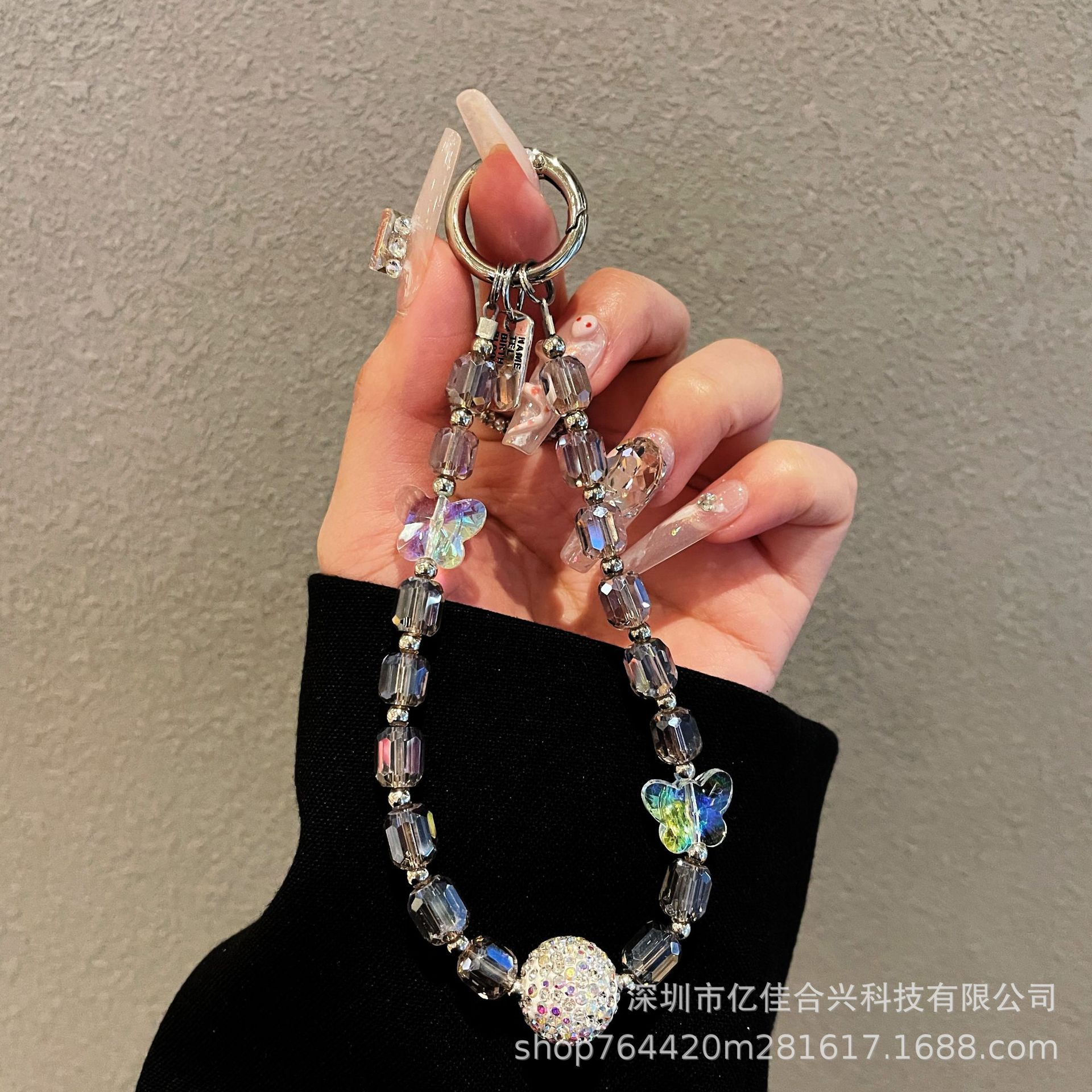 Japón y Corea del Sur estilo transfronterizo nuevo caso de teléfono móvil colgante cadena de cristal string arco de diamante cadena de teléfono móvil colgante de muñeca