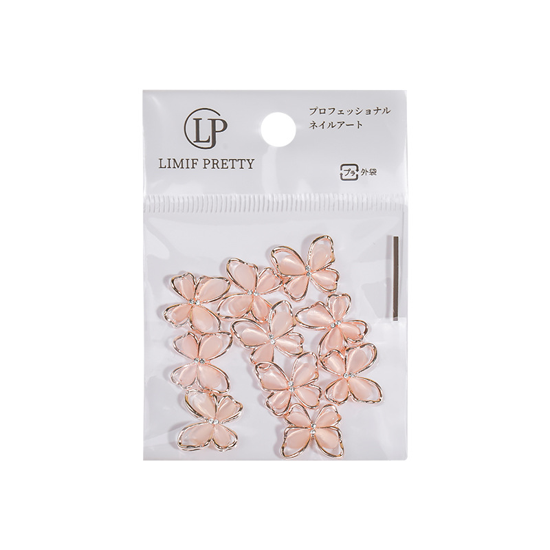 Uñas de cristal gato ojo mariposa aleación joyería en línea celebridad uñas hueco mariposa desgaste accesorios de uñas al por mayor