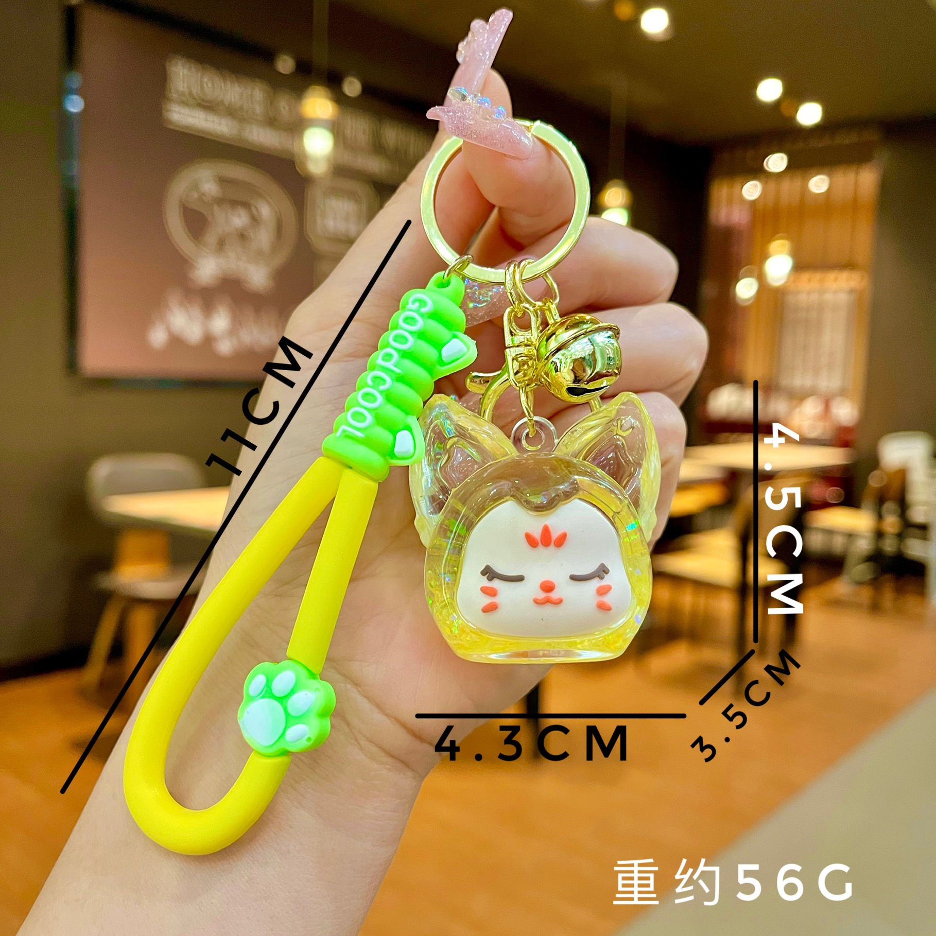 Aceite de gato garra arenas movedizas llavero lindo dibujos animados cadena colgante captura muñeca máquina agarrar pequeño regalo al por mayor