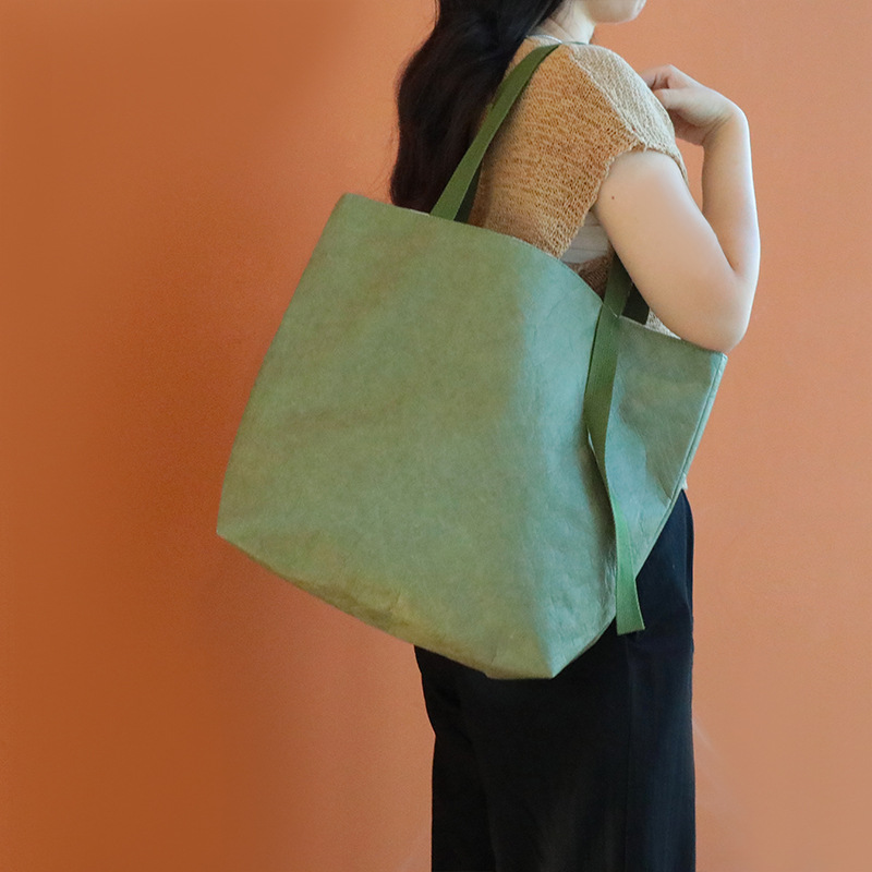 Bolsas de papel DuPont personalizadas retrógrados espesación impermeable kraft bolsas de regalo de hombro logotipo personalizado