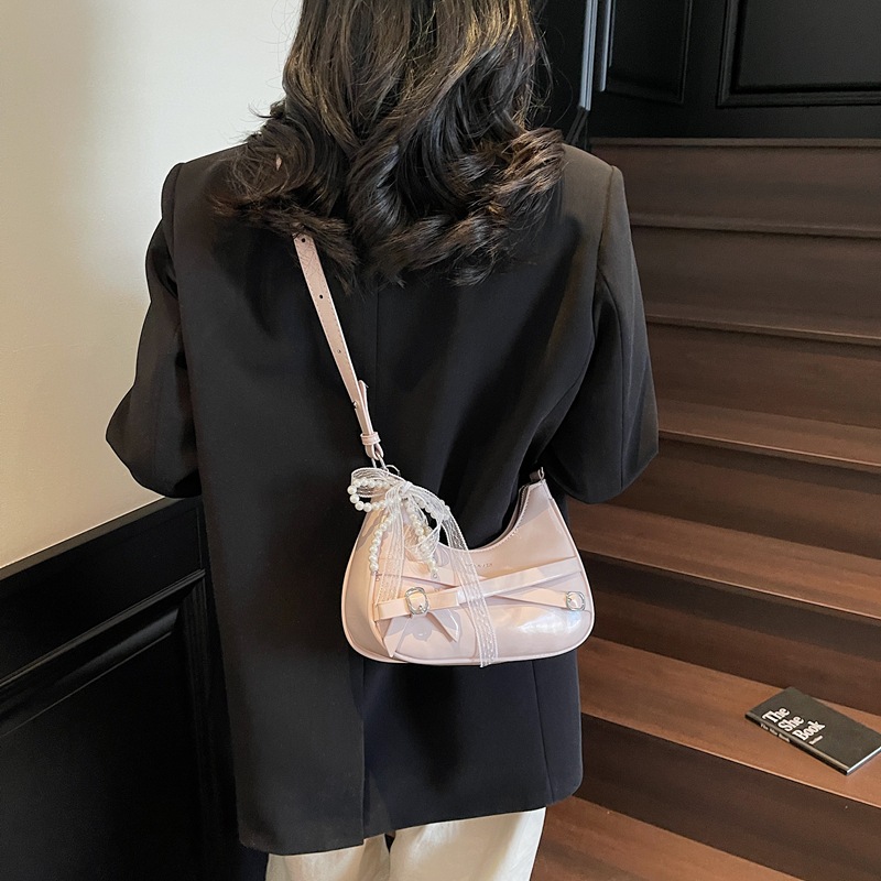 Nicho de cera de aceite bolso de piel mujer 2025 nuevo estilo de verano de moda de encaje arco brazalete textural mochila