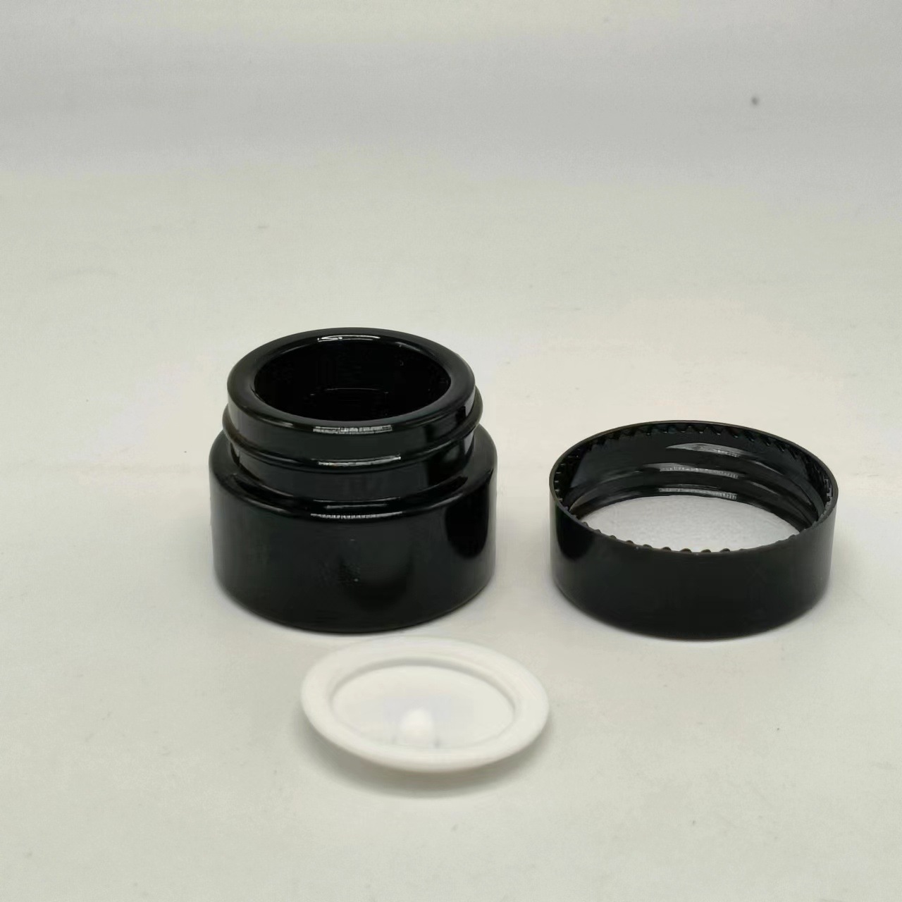 Botella de crema de porcelana negra en stock 5g botella de crema de ojos de vidrio negro botella de crema de esencia botella de crema de vidrio cosmético botella de crema