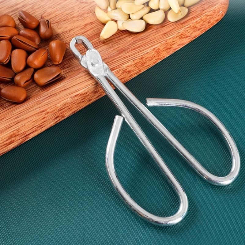 Pine nut shell opener