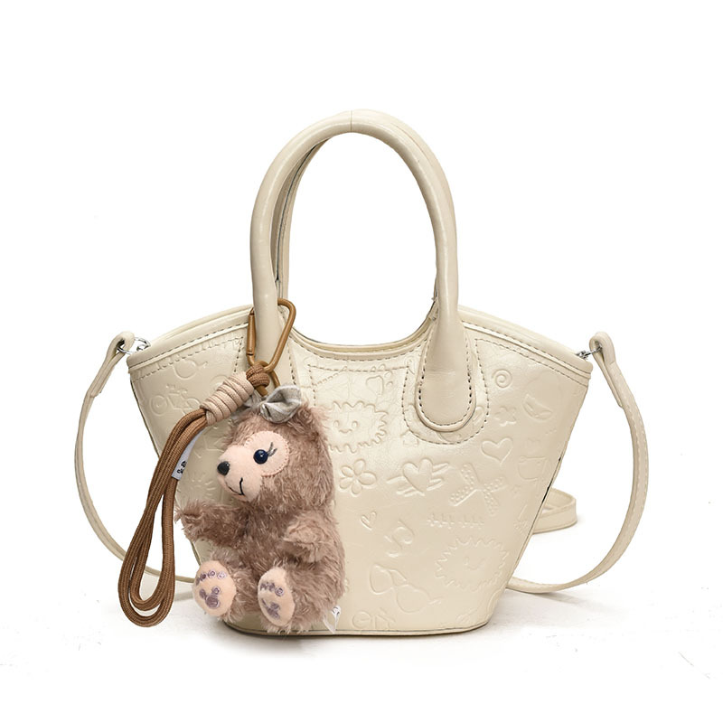 Nicho coreano bolsas de cesta de verduras de mano primavera de mujeres 2025 nueva moda encantadora bolsa en relieve bolsas de mochila