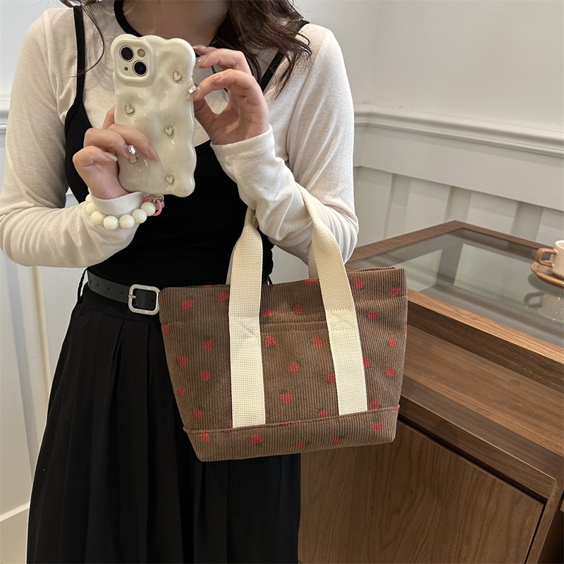 2024 otoño nueva gran capacidad simple moda encantadora impresión de fresas de moda coreana bolsos de chicas de estilo universitario