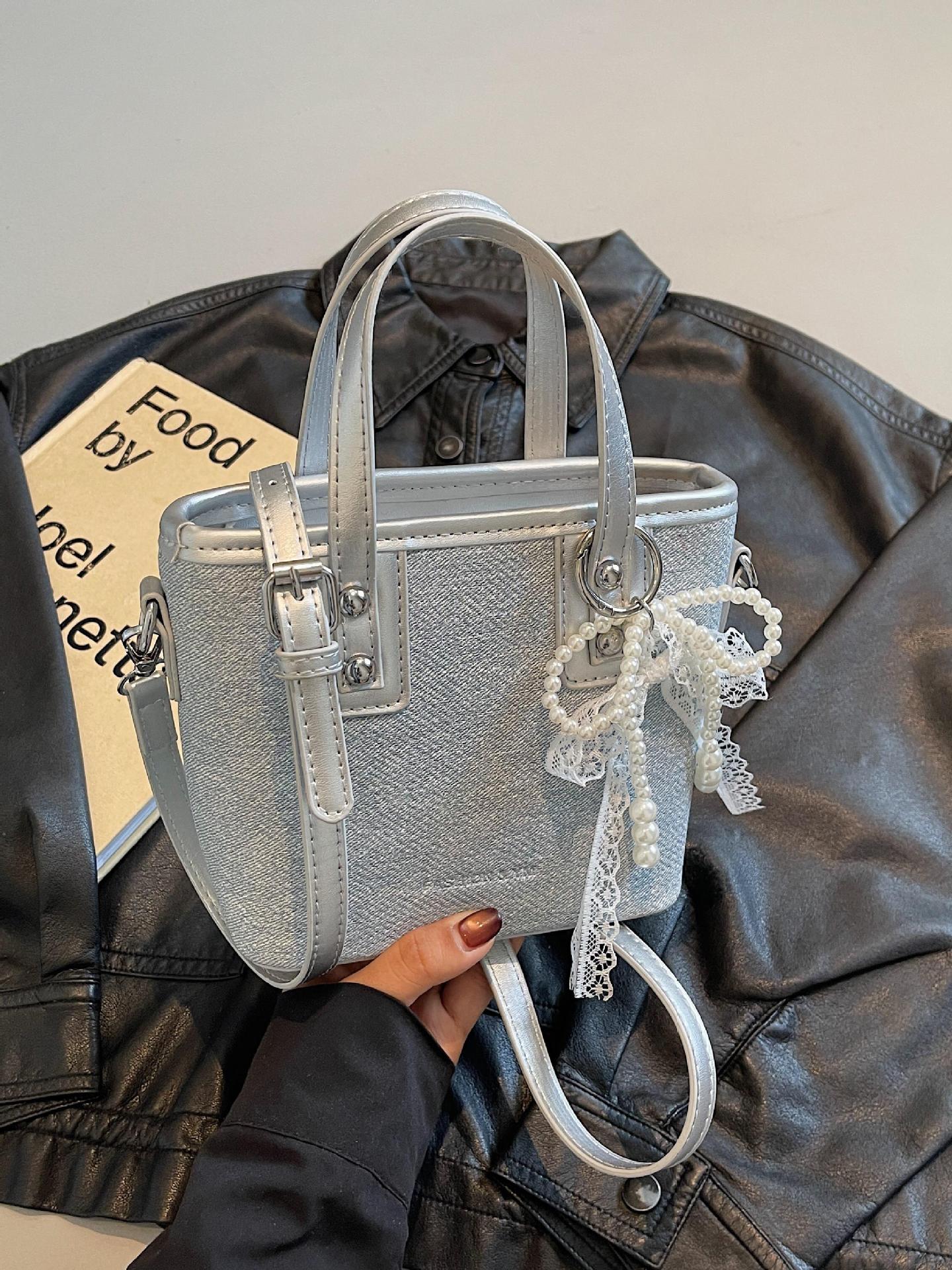 Bolso de cubo de mano de estilo occidental de moda para mujer 2025 nuevo bolso de hombro de todo fósforo de color de contraste bolso de mensajero de viaje de textura de moda