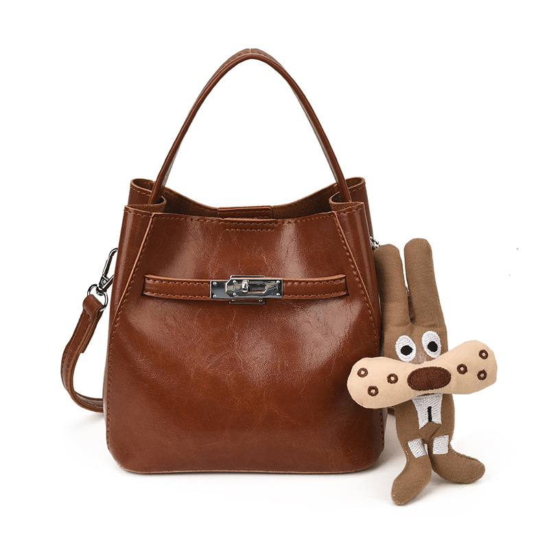 Bolso de viaje bolso de cubo de mano mujer 2025 nuevo otoño invierno alto sentido retro bolso de hombro relajado bolso de mochila