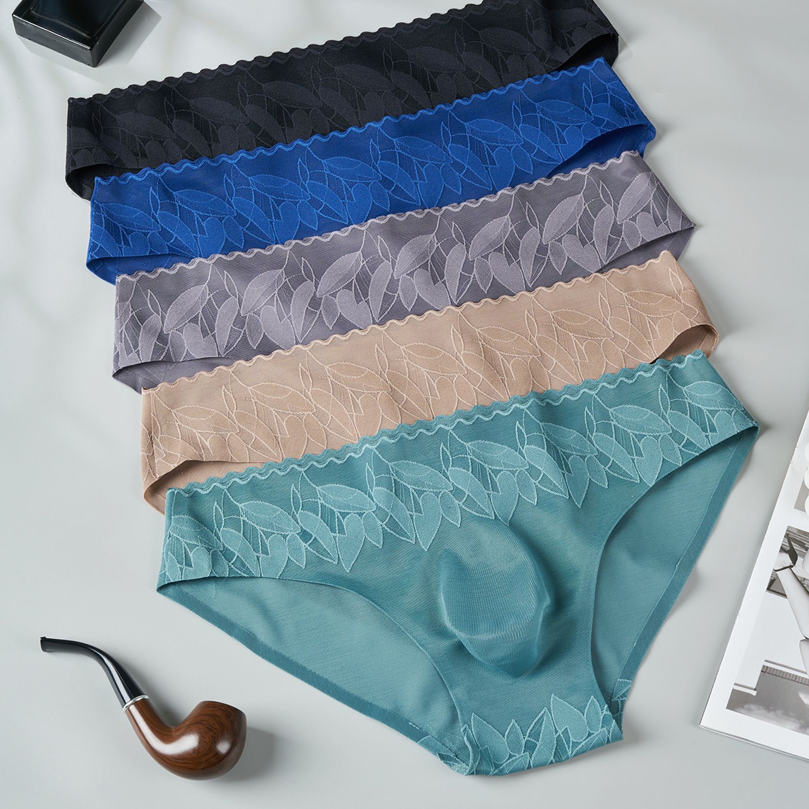 Nuevas calzoncillos de hombre elásticos de encaje 3D bolsas convexas estereoscópicas calzoncillos de hombre sin marcas