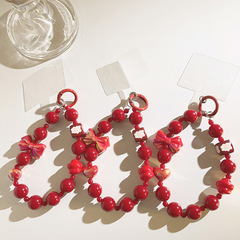 新年喜慶紅色蝴蝶結珠珠鏈手提鏈腕帶式通用手機殼創意手機掛繩女
