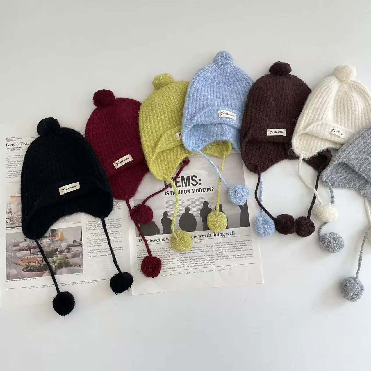 艾摩贝贝儿童2025冬款时尚球球护耳帽男女童个性毛线帽保暖针织帽