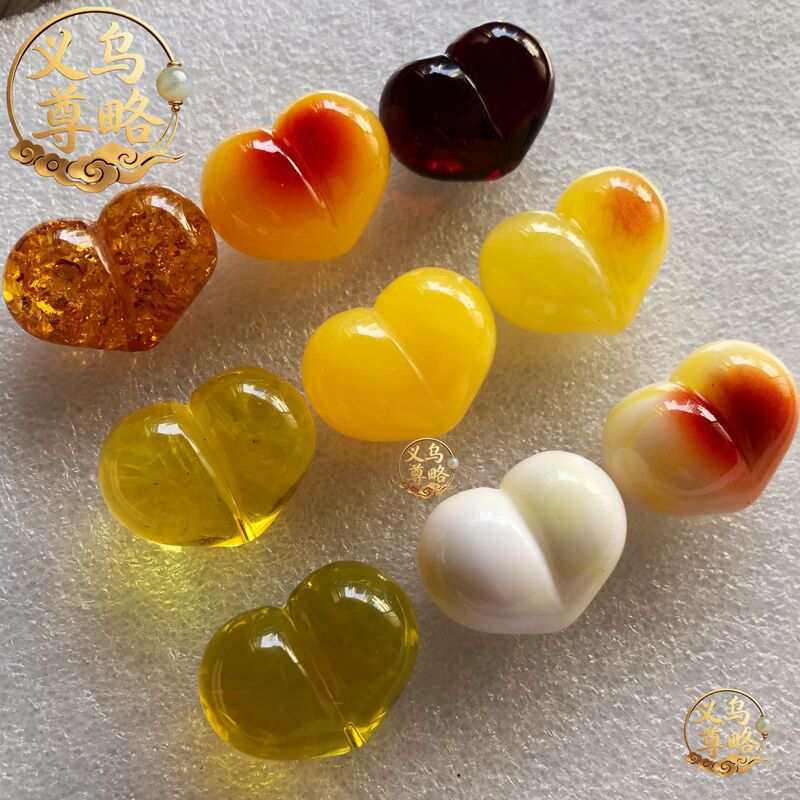 Imitation amber peach heart-shaped accessory, resin amber with natural color, loose beads with center hole, DIY bracelet and craft beading accessories Imitation amber peach heart-shaped accessory, resin amber with natural color, loose beads with center hole, DIY bracelet and craft beading accessories