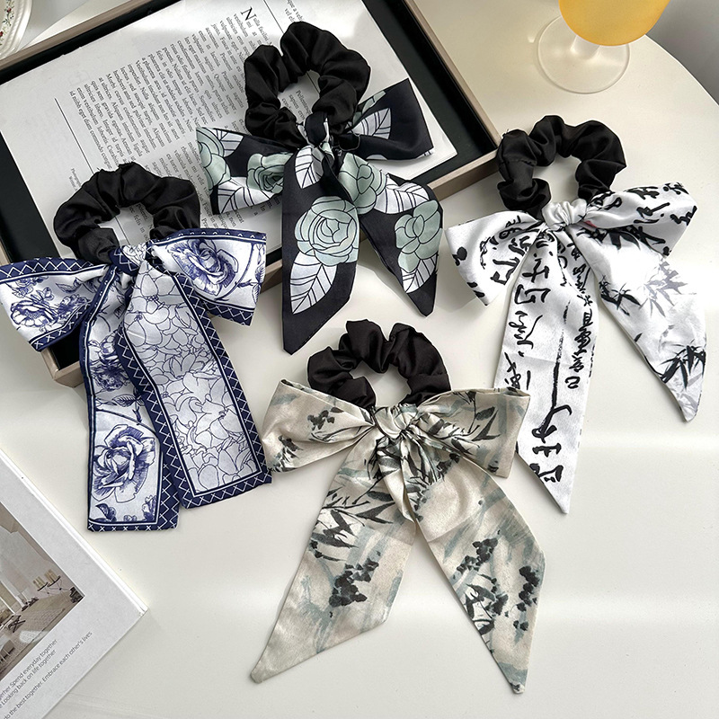 Anillo de cabello de arco femenino retro elegante correa francesa temperamento de alta sensación de impresión de anillo de intestino suave tocado versátil