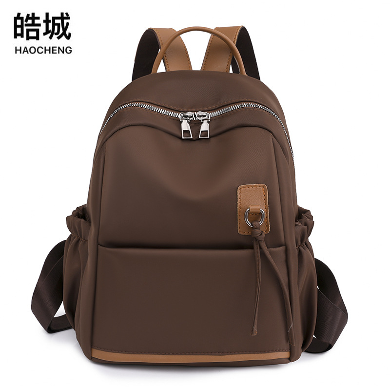 Spot al por mayor 2023 nuevo estilo casual damas Oxford mochila moda simple arte viajes mochila marea