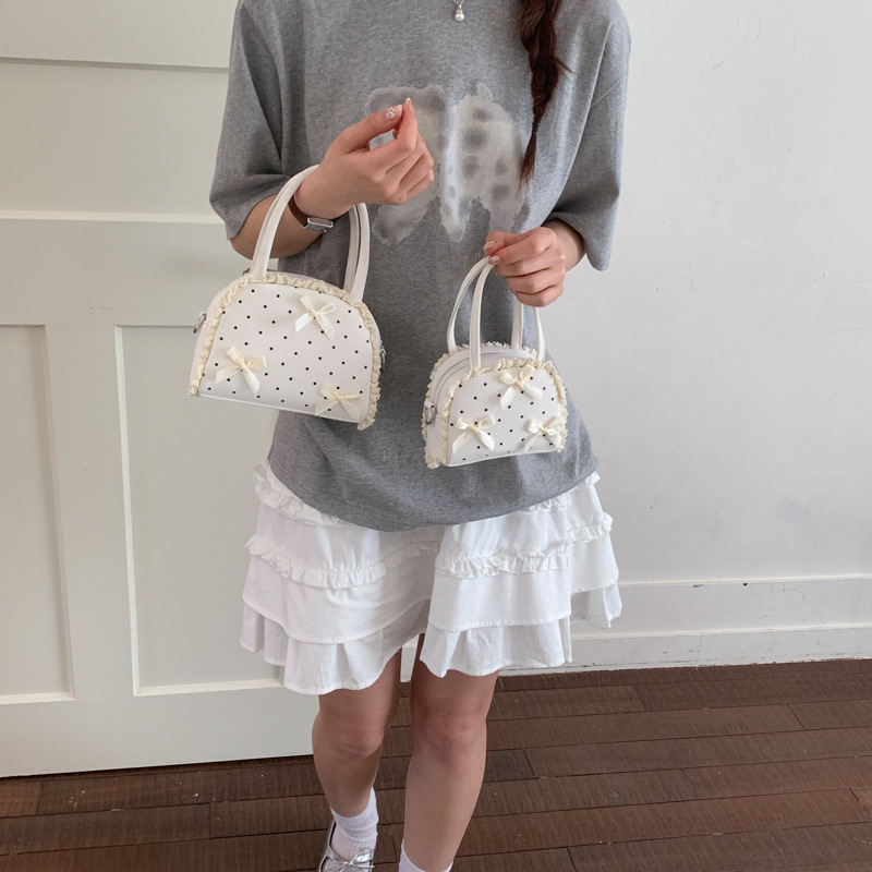 2026 nuevo bolso Macaron mini bolso de lápiz labial diario lindo arco de hombro bolso de concha mochila