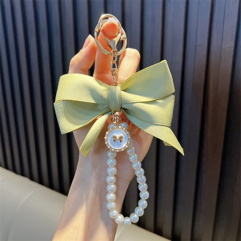 Perlas hechas a mano llaveros de perlas mujeres arco de correa de color bolsos colgantes pequeños regalos al por mayor