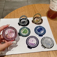 5dメッキ透明携帯電話エアバッグ流砂スタンド伸縮可能な磁気吸引折り畳み創意フラッシュ粉携帯電話スタンド卸売り