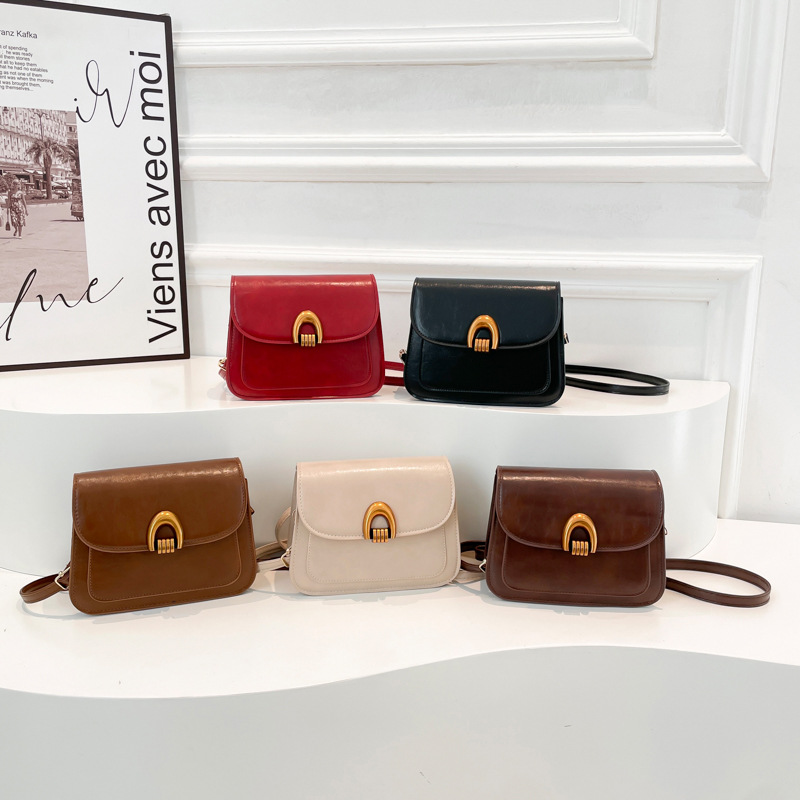 2025 nueva moda temprana primavera bolsa de silla textura casual gran capacidad retrógrada piel de cera de aceite de hombro mochila para mujeres