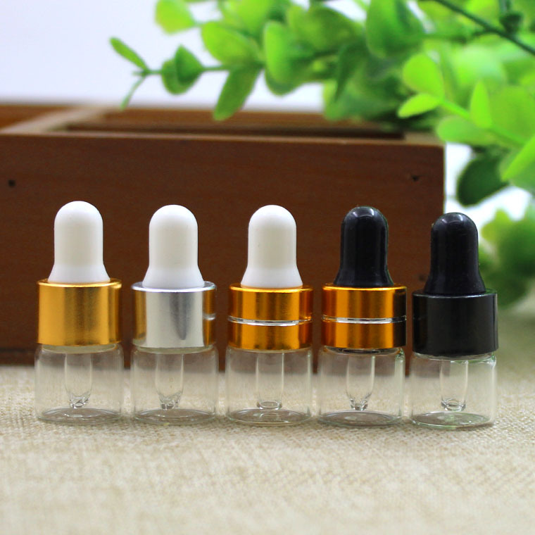 1ml de fábrica al por mayor botella de aceite esencial transparente tangente oro blanco pegamento cabeza cuentagotas botella de vidrio botella pequeña muestra botella sub-botella