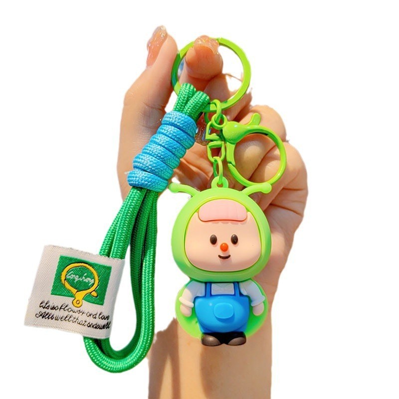 lindos dibujos animados luciérnagos llavero rojo estereoscópico muñeca de goma suave colgante de alto valor de la cara brillante pareja colgante