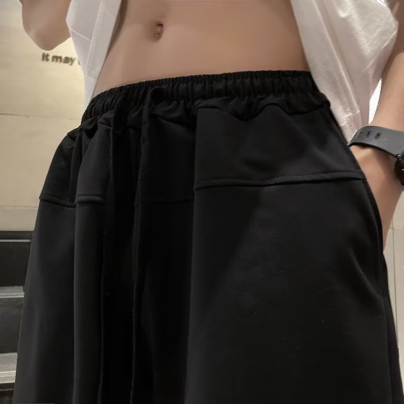 Marca de moda ins pantalones cortos casuales de verano para hombres estilo caliente holgado tendencia casual ropa exterior pantalones de cinco puntos de estilo coreano de todo fósforo