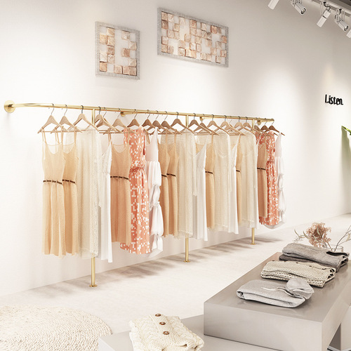 Golden clothing store display rack wall-mounted hanging rods against the wall combination hanging women's clothing store shelves