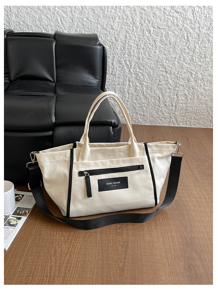 Bolso de lona de gran capacidad para mujeres 2026 nuevo tipo de mochila de hombro simple y casual para la clase de la bolsa de viaje