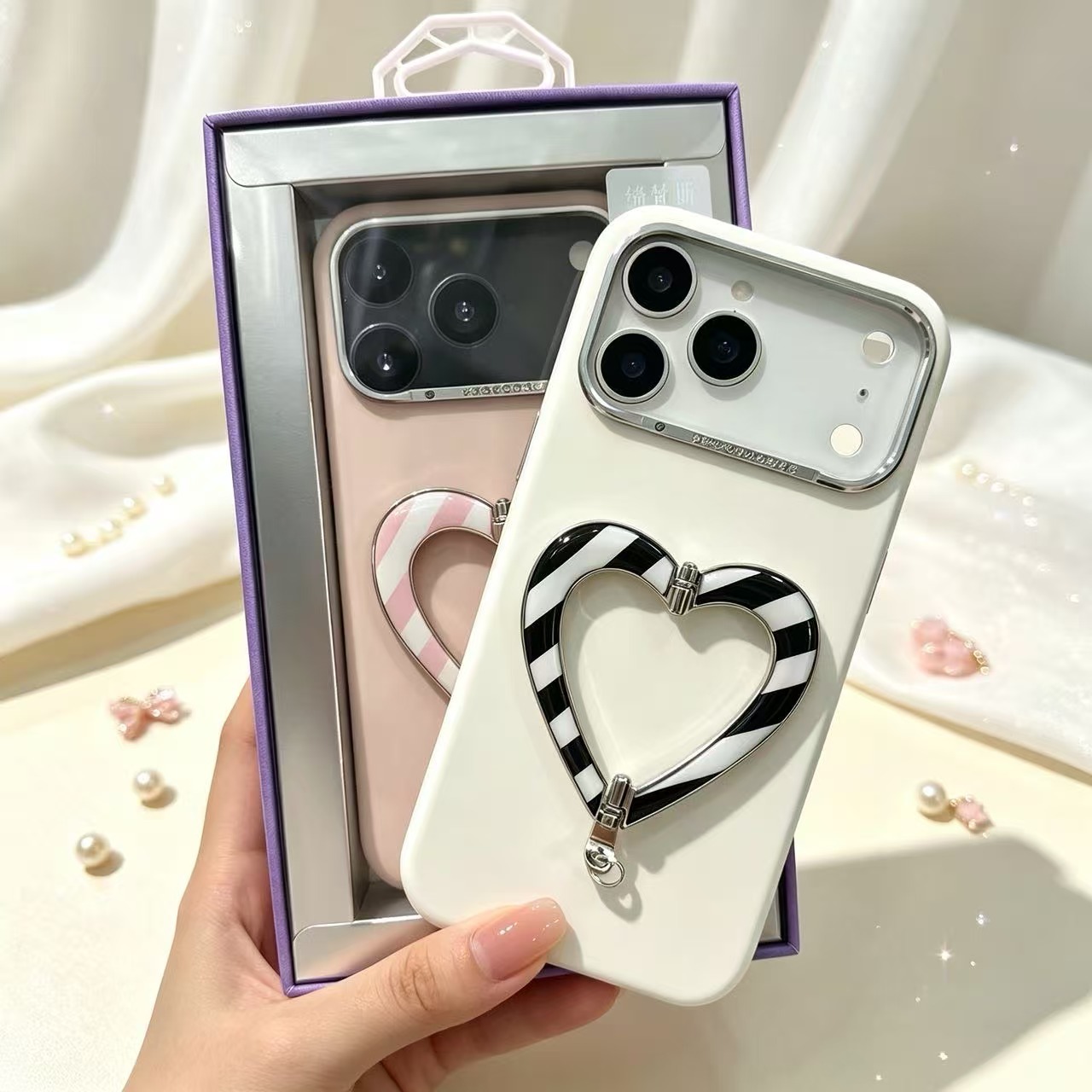 ซีรีส์ลูกอมรูปหัวใจ เหมาะสำหรับเคสซิลิโคนเหลว iPhone 18 Pro Max พร้อมตัวยึดรูปหัวใจ และเคสประดับเพชรสำหรับ iPhone 17 Pro