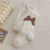 White tights with bow, with embroidery