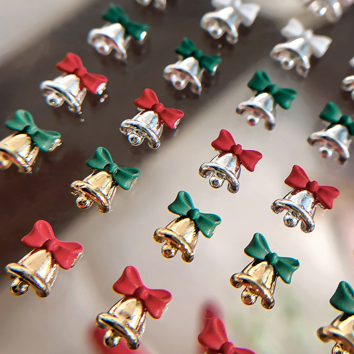 Net red Christmas bell nail jewelry bow gold and silver alloy exquisite light luxury wind wear armor decoration wholesale