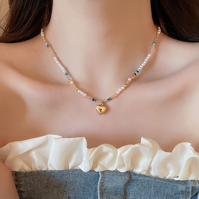 Collar con colgante de cuentas de estrella de color de verano, dulce femenino, pequeña cadena de clavícula fresca, estilo de vacaciones, collar de todo fósforo de nicho