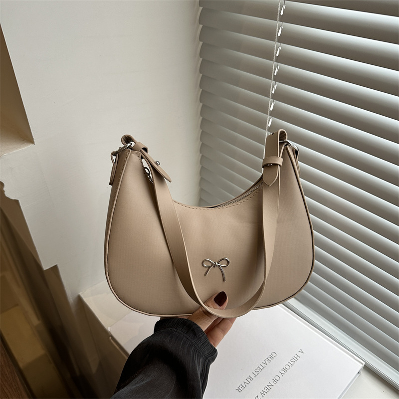 Bolso de axila con lazo para mujer 2024 nuevo estilo literario minimal bolso de hombro textura de viaje de moda de luna nueva marea