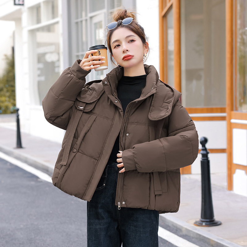 Corea del Sur Dongdamen ropa de algodón de pluma para mujeres corto 2025 invierno nuevo algodón delgado chaqueta con capuz transfronteriza