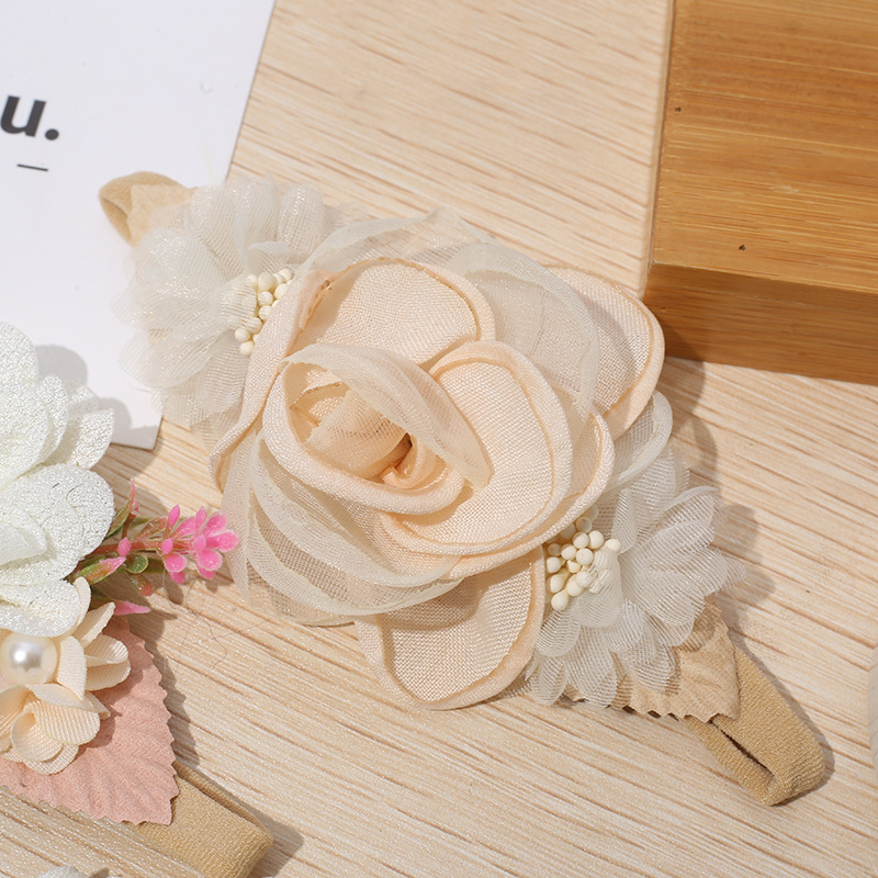 Fábrica al por mayor nuevo estilo pastoral de nylon Flor del pelo del bebé banda fresca foto accesorios para el cabello