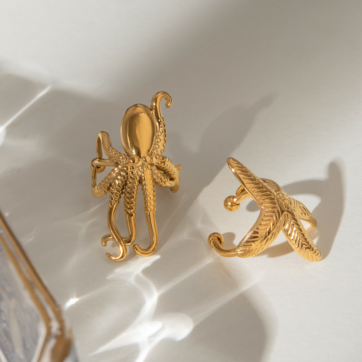 Wanxing Europa y América de acero inoxidable estrellas de mar clips de hueso de orejas de nicho de alta calidad pendientes de titanio joyas de orejas de acero pendientes transfronterizos