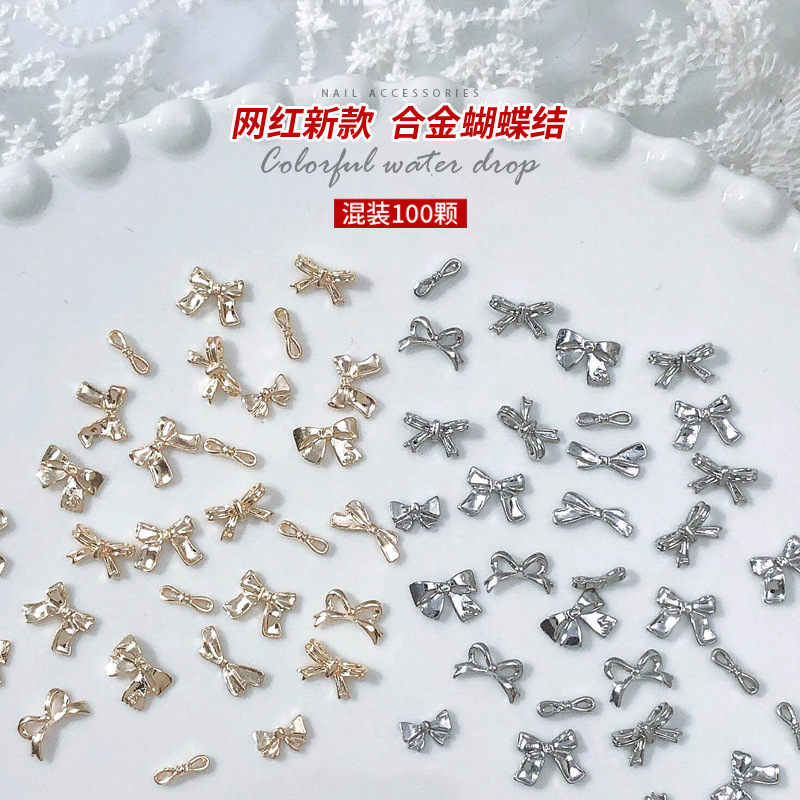 100 aleación arco uñas joyería nueva celebridad en línea tridimensional metal diamante mezclado oro plata accesorios de uñas