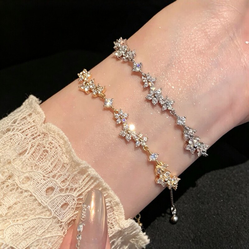 Light luxury cubic zirconia cherry blossom bracelet for women, with adjustable drawstring, featuring a four-petal flower design, offering a unique, high-end, and versatile style, available for wholesale