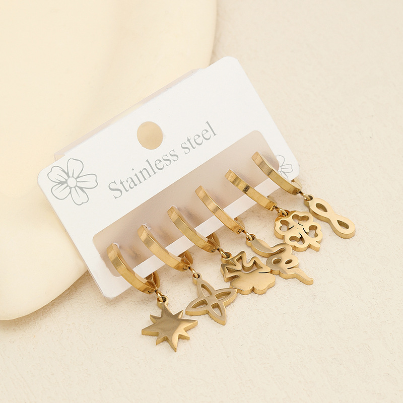 Joyería de acero inoxidable transfronterizo corte hueco flor planta Awn estrella patrón geométrico oreja dorada hebilla traje fabricante