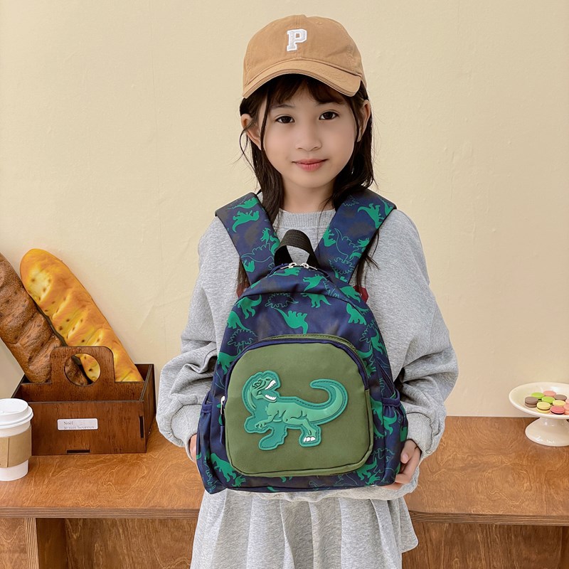 2025 nueva mochila de dinosaurios infantil impresa de dibujos animados encantadora mochila para estudiantes de jardín de infantes