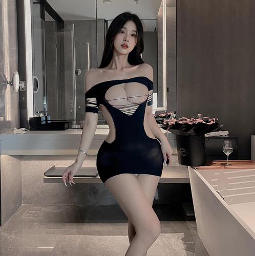 Plus-size women's flirtatious fishnet bodysuit with a tearable crotch—sexy, hollowed-out full-body black silk look that exudes pure allure.