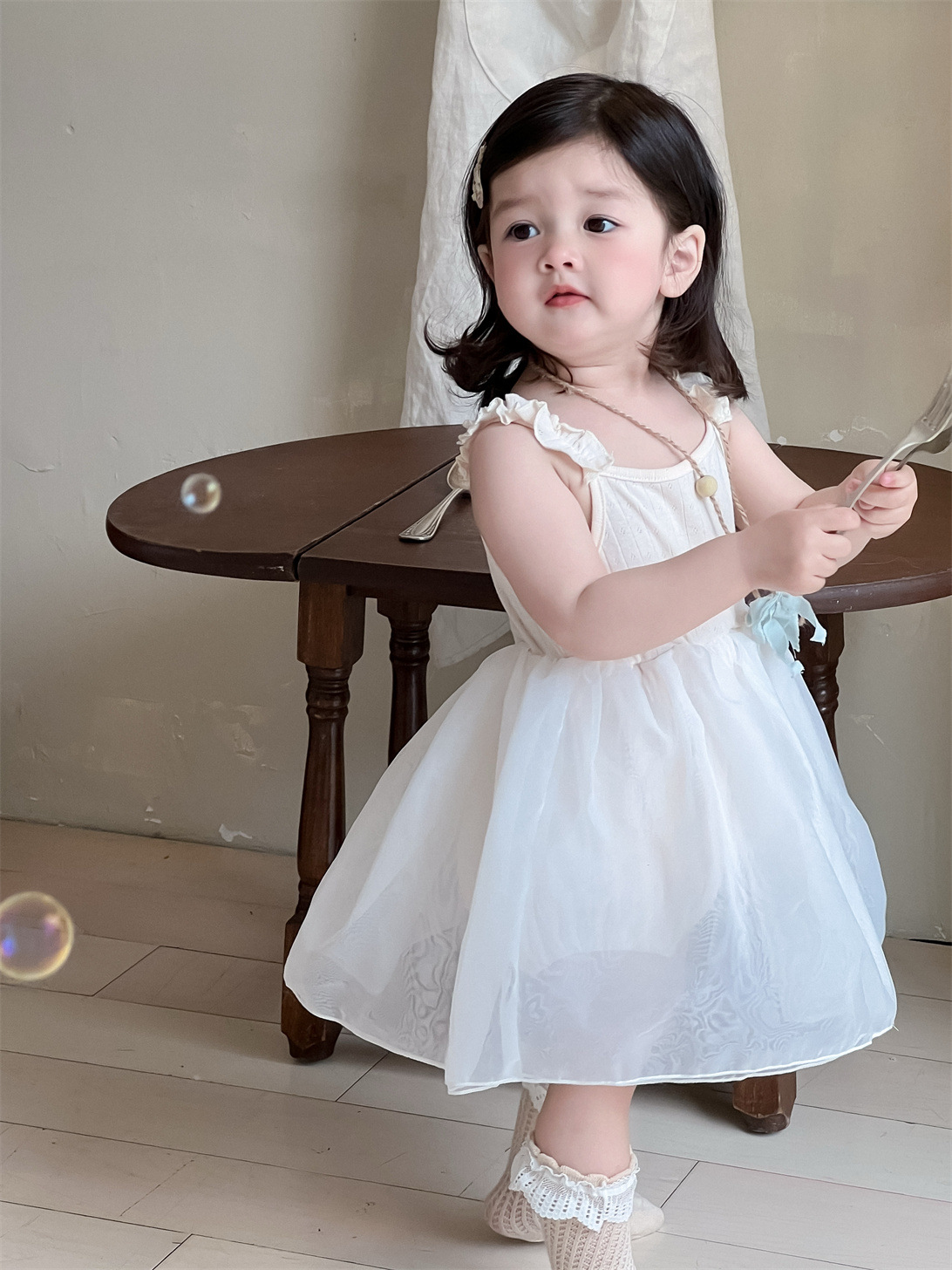 Vestido de malla para niñas, estilo fino de verano, ropa para niños coreanos, falda de trasero con correa de bebé, falda de princesa nueva 2025